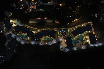 an aerial view of a city at night with lights at Cozy Studio Apartment at Naiyang Beach G507 in Phuket Town