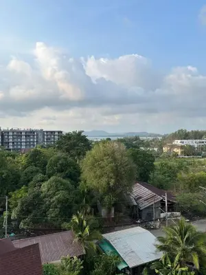 a view of a city with trees and buildings at Palmyrah Surin sea view in Surin Beach