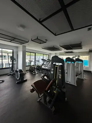 a gym with treadmills and cardio equipment in a building at Duplex studio on Naiharn Beach B21 in Rawai Beach