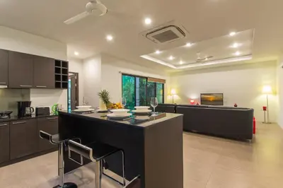 a kitchen with a large island in a room at Tropical 3BR Pool Villa Nga Chang NC10, Gated Residence, 10 min Drive to Nai Harn Beach in Rawai Beach
