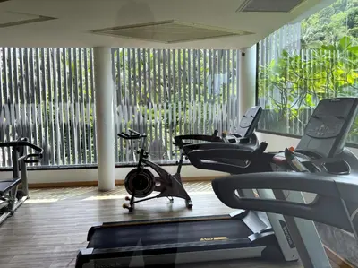 a gym with treadmills and exercise bikes in a room at Sea view apartment at Aristo2 by Lofty in Surin Beach