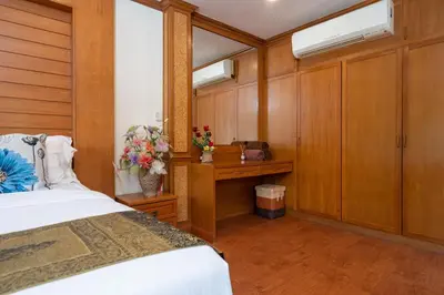 a bedroom with a bed and two skylights at Private Villas Bangtao in Bang Tao Beach
