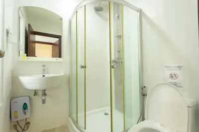 a bathroom with a shower and a toilet and a sink at 12 minutes Patong Security Gym Sauna AP12 #V28 in Kamala Beach
