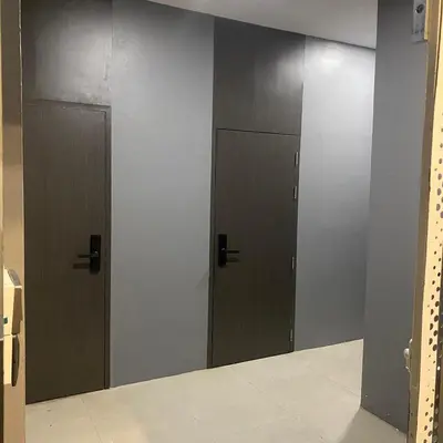 a row of three elevators in a locker room at Doze Patong in Patong Beach