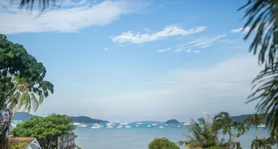 a view of the ocean with boats in the water at Nariya Bayfront Phuket in Chalong