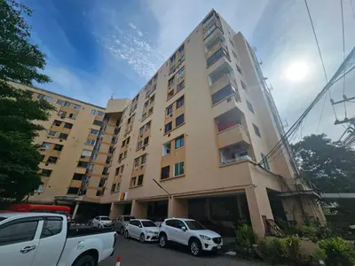 a large building with cars parked in front of it at Yuya's sweet Condo suite in Patong Beach