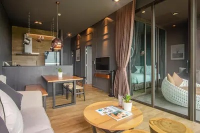 a living room with a couch and a table at Luxury Suite of 70 Sqm in Rawai Beach in Ban Saiyuan (1)