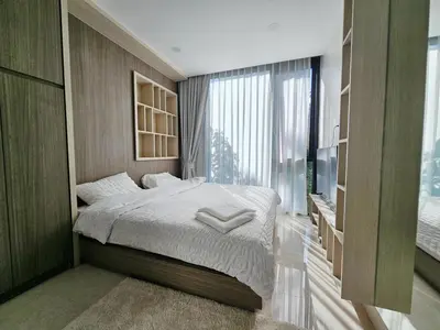 a bedroom with a bed and a large window at The Viva Patong Condo - 1Bdr - 35sqm Studio - Patong Hills in Patong Beach