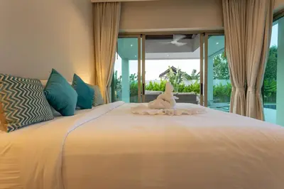 a white stuffed animal sitting on top of a bed at Brand New Completed v124 in Chalong