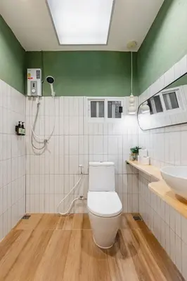 a bathroom with a toilet and a sink at Patong Apartments Steps to Beach & Bangla Road Sleeps 6 in Patong Beach