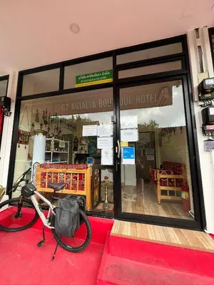 a bike parked in front of a store window at 07 Antalya Boutique Hotel in Patong Beach