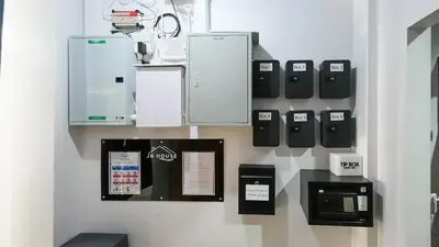 a display of appliances on a wall at JB House Patong in Patong Beach