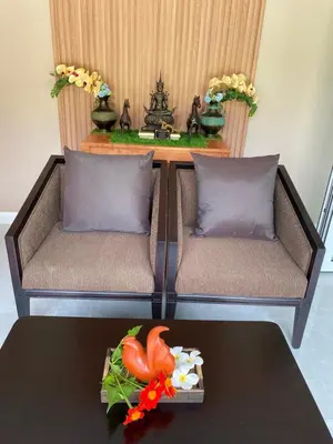 a living room with two couches and a table at Green Tree Cottage5 in Klong Muang Beach