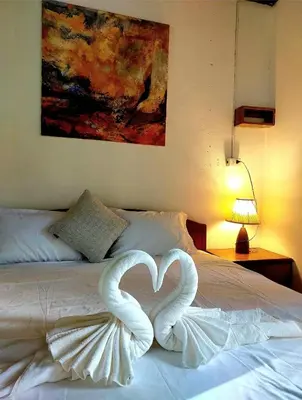 two swans making a heart on a bed at House On The Bay2, Koh Yao in Ko Yao Noi