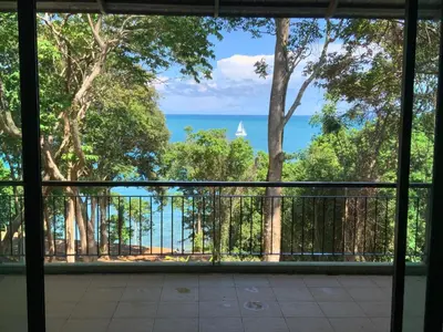 a view of the ocean from a balcony at Beachfront villa in Rawai in Phuket Town
