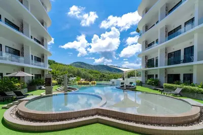 a view of the courtyard of a building with a swimming pool at Spacious Pool View 1BR Apartment in Utopia Naiharn Residence near Beach, UTN D604 in Rawai Beach