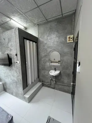 a bathroom with a sink and a mirror at Green Dreams Guesthouse in Ban Lo Long