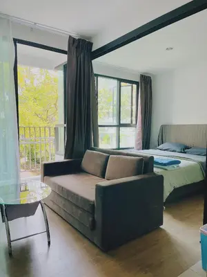 a living room with a couch and a bed at 47near Shopping Malls and Naka night market in Phuket Town