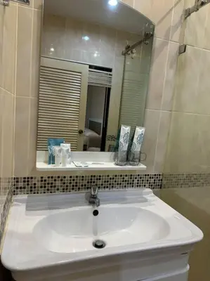 a bathroom with a white sink and a mirror at คอนโดใกล้หาดในทอนNai Thon Beach Room A410 in Nai Thon Beach