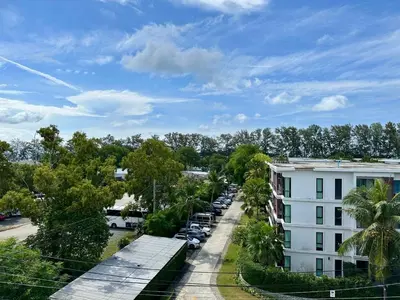 an aerial view of a street with a building at Title V Sunny Nest Sea View 5fl Pool Gym in Rawai Beach