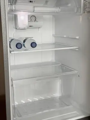 an empty refrigerator with its door open with its at Title V Sunny Nest Sea View 5fl Pool Gym in Rawai Beach