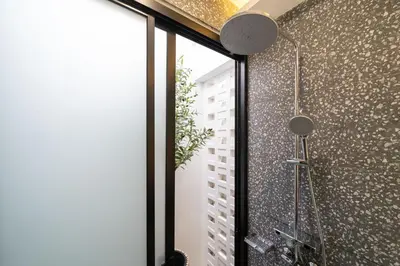 a shower in a bathroom with a glass window at Stylish Pool Villa in Chalong-Phuket-2 Bedroom in Ban Suan