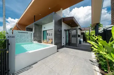 a swimming pool in the backyard of a house at Stylish Pool Villa in Chalong-Phuket-2 Bedroom in Ban Suan