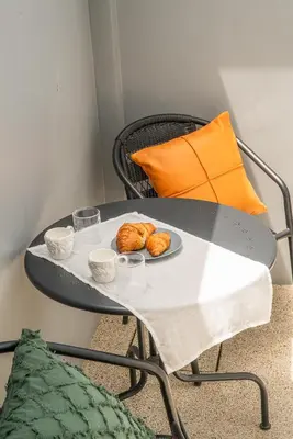 a table with a plate of croissants on it at The Rich Villas House Pool Chalong Robinson in Ban Suan