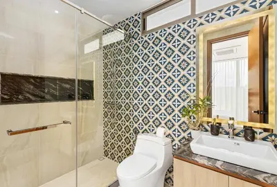 a bathroom with a toilet and a sink and a shower at The Ozon Bangtao 3-bedrooms Villas with pool by My Home Phuket in Laguna Phuket