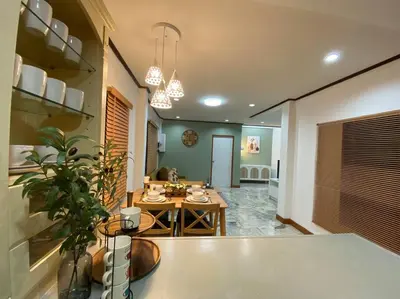 a living room with a table and a dining room at Kata#near macro karon # 1km to kata beach in Karon Beach