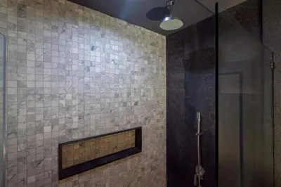 a bathroom with a shower with a glass door at Spacious Pool Access Apartment with 2 BR - Rawai in Ban Saiyuan (1)