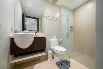 a bathroom with a sink and a toilet and a shower at Studio Apartment - Emerald Terrace Patong in Patong Beach