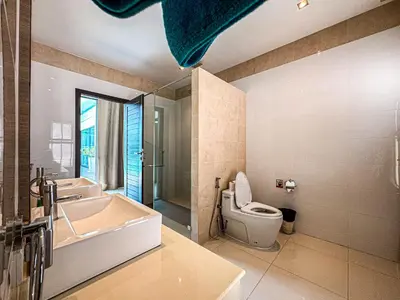 a bathroom with a tub and a toilet and a sink at VILLA DESTINY - Luxury Villa Near Nai Harn Beach in Ban Saiyuan (1)