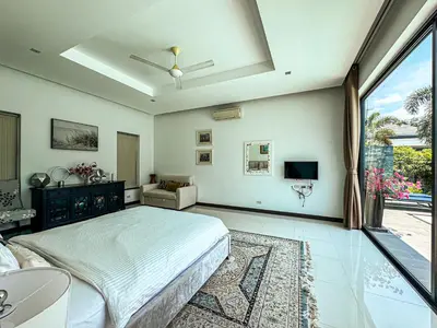 a bedroom with a bed and a large window at VILLA DESTINY - Luxury Villa Near Nai Harn Beach in Ban Saiyuan (1)