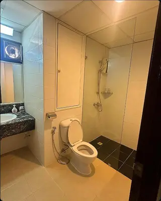 a bathroom with a toilet and a shower at Patong Tower Mountain View in Patong Beach