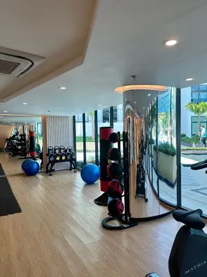 a gym with a room with a lot of exercise equipment at Duplex Luxury Apartments in 5 Star Hotel in Rawai Beach