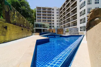 a swimming pool in the middle of a building at Ocean View Treasure Residence in Patong Beach