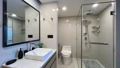 a bathroom with a shower and a sink and a toilet at Apartment 5 Star Hotel LaVita in Rawai Beach