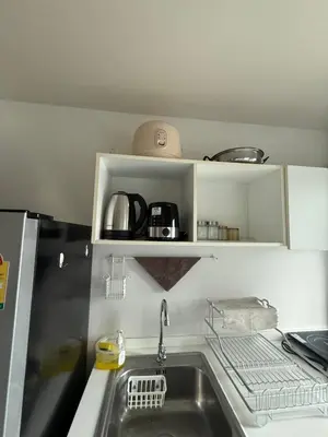 a kitchen with a sink and a counter top at D-Condo Mine Kathu in Ban Ket Ho