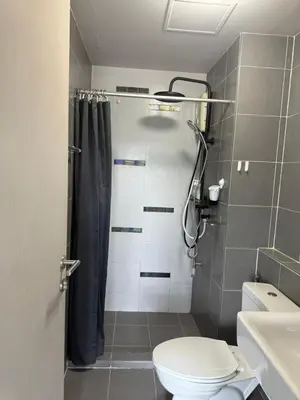 a bathroom with a shower with a toilet and a sink at D-Condo Mine Kathu in Ban Ket Ho