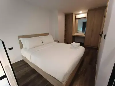 a bedroom with a large white bed in a room at Utopia Naiharn - Room3 - B124 in Rawai Beach