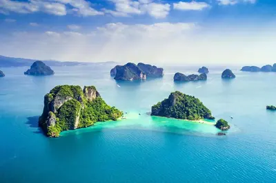 an island in the ocean with rocks in the water at XX Bao Patong Beach PHUKET เบา หาดป่าตอง ภูเก็ต in Patong Beach