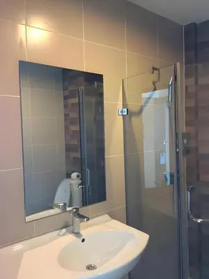 a bathroom with a sink and a shower with a mirror at xx GO INN Ao Nang Krabi - โกอินน์ อ่าวนาง กระบี่ Aonang in Ban Khlong Haeng