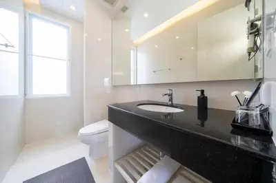 a bathroom with a sink and a toilet at Patong WiN HOUSE Villa in Patong Beach