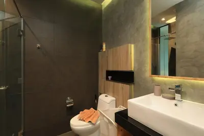 a bathroom with a toilet and a sink and a shower at Relife Windy B226 at NaiHarn beach by CapitalPro in Phuket Town