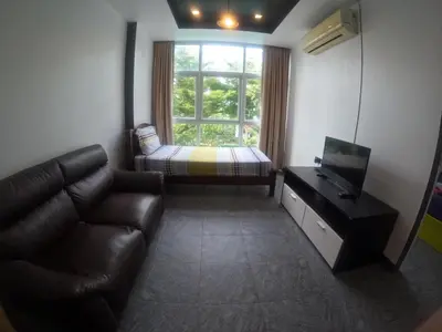 a living room with a couch and a bed and a window at At Seacondo-1 Bedroom-A07 in Haad Klong Son