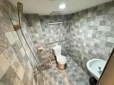 a bathroom with a toilet and a sink at Chilli Salza Patong in Patong Beach