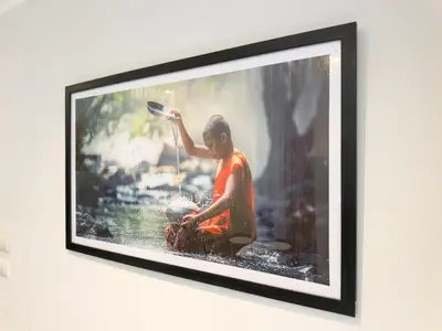 a picture of a person in the water on a wall at Garden View Apartment 1BR - NV-103 in Chalong