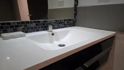 a white sink in a bathroom with a mirror at Big Buddha View Apt-1BR T1-306 in Chalong