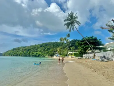 a group of people standing on a beach at Sea Dreamer Ao Yon Beach House in Ban Ao Makham